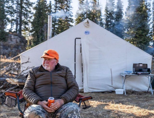 Man in front of his tent